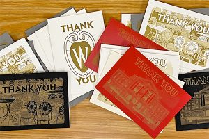 Variety of thank you cards on a wooden table