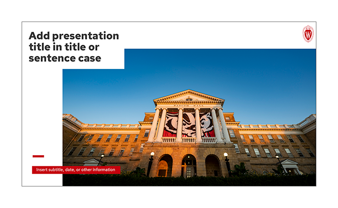 Screen shot of one of the templates from the UW-Madison Photographic PowerPoint templates featuring a large title in the upper left, crest in the upper right, a large, central photograph and mini bar with subtitle on a red background in the lower left corner.