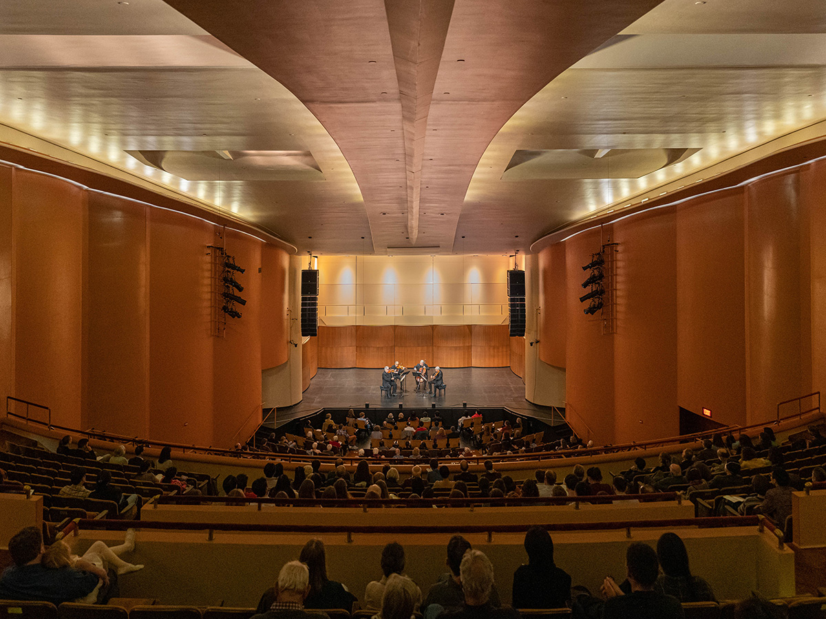 Audience members watch a string quartet at the Memorial Union Theater.