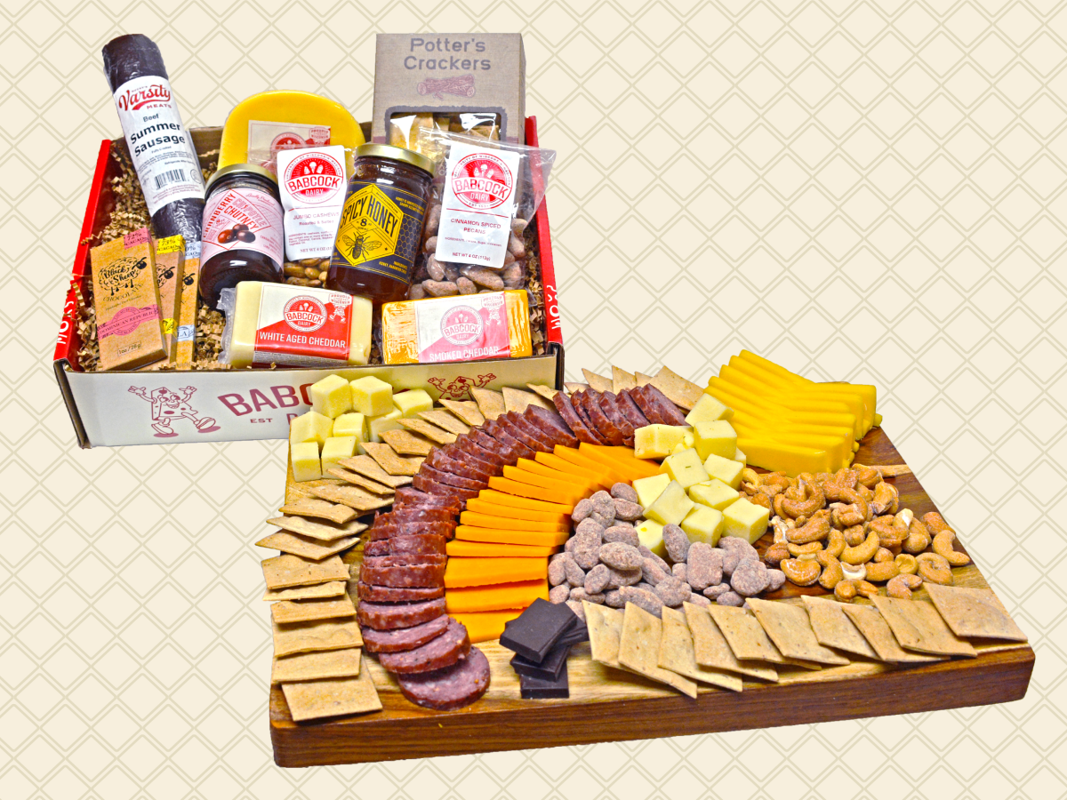 A Babcock Dairy Cheese Gift Box with contains half-pound pieces of Gouda, White Aged Cheddar and Smoked Cheddar, UW Summer Sausage, Black Sheep Dark Chocolate Bars (3), 4 oz. Honey Toasted Pecans, 4 oz. Jumbo Cashews, Savory Accents’ Cranberry Chipotle Chutney, Spicy Honey and assorted Potter’s Crackers.