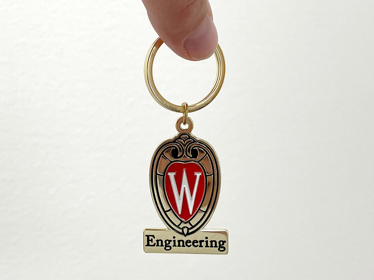 A gold keychain with the UW crest and the word Engineering below it.