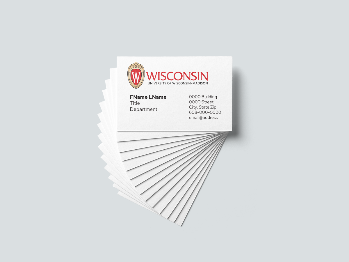 Stack of business cards fanned out with UW–Madison logo appearing at the top of the card.