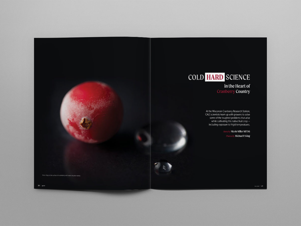An open spread of a magazine with a zoomed in photo of a cranberry