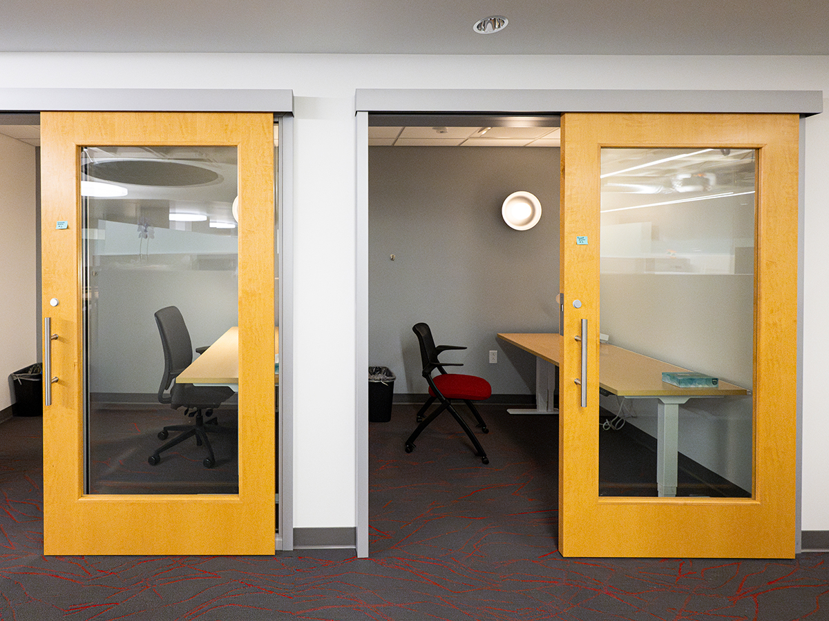 Two small offices with sliding glass and wooden doors