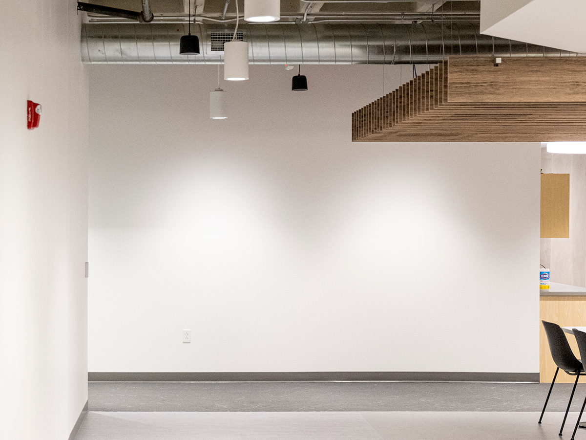 Before photo of a blank wall in an office space