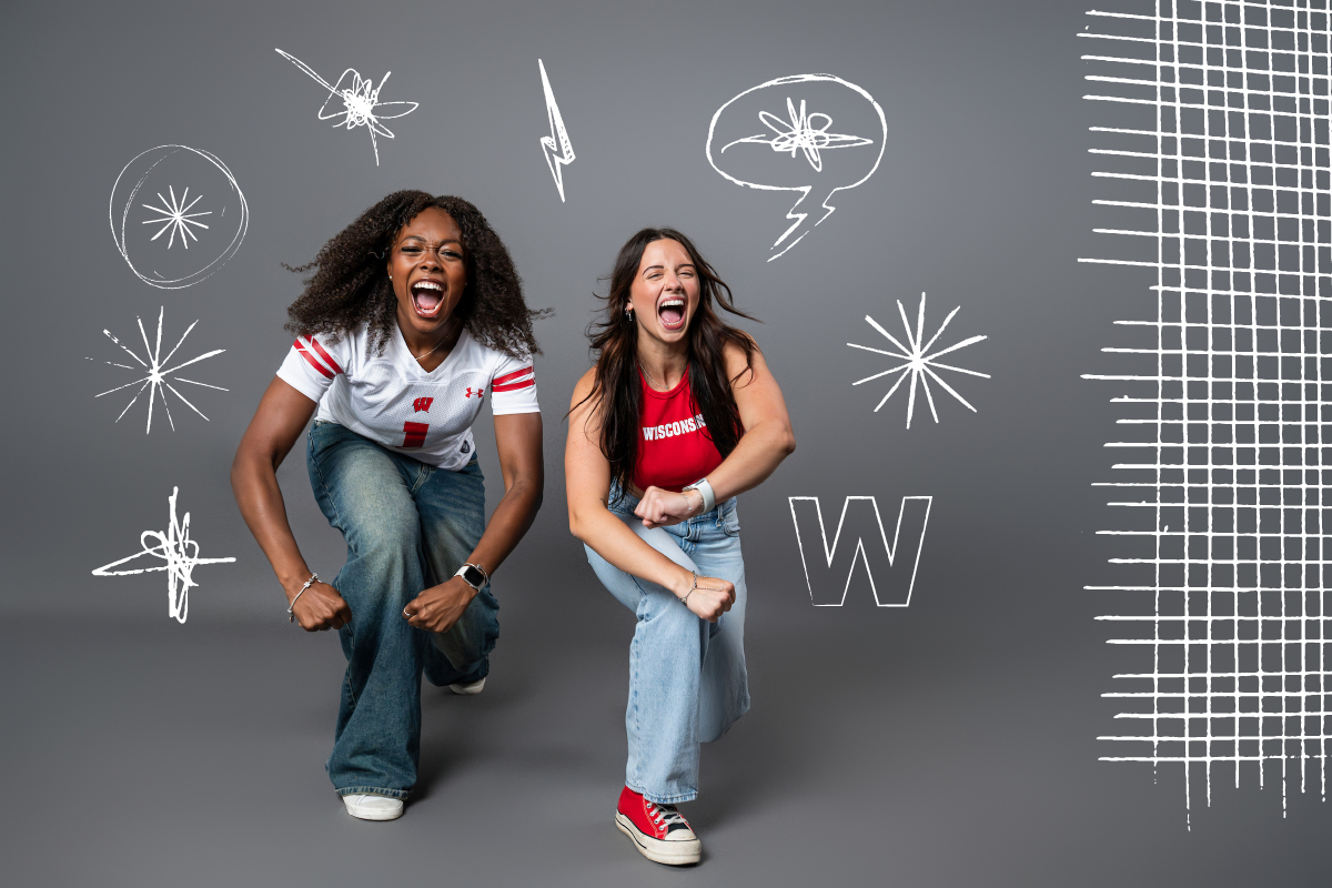 Two Badger fans yelling while leaning forward
